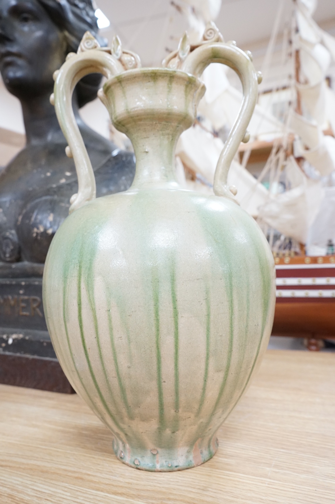 A Chinese green glazed terracotta ‘dragon’ handle vase, 42cm